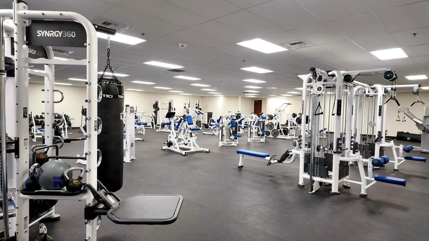 Life Fitness SYNRGY360 functional training rig, heavy bag, and cable systems at NCE's fitness lab