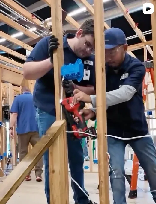 NCE Electrician students wiring in the framing lab